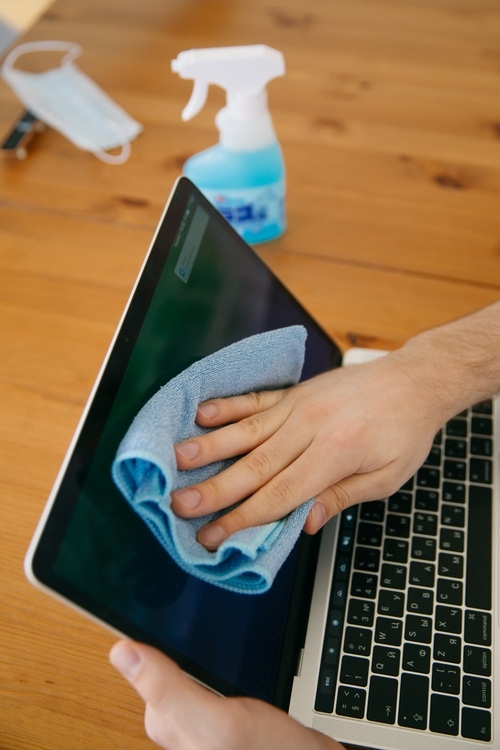 Wiping down a laptop screen